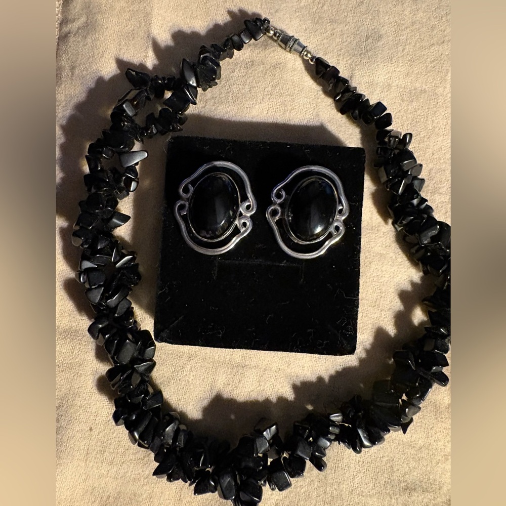 Vintage black coral necklace. 16"
Strand. Matching earrings in sterling silver.